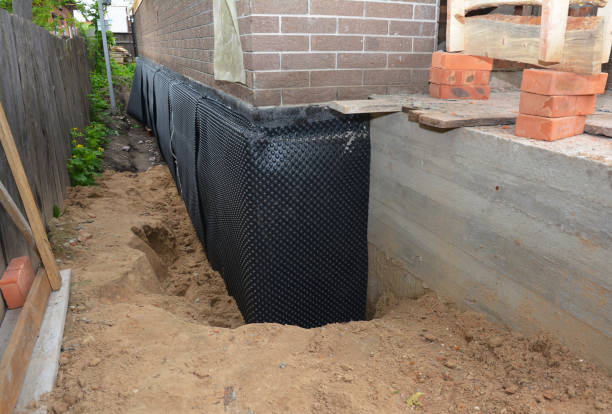 Happy homeowners after waterproofing job in Maywood